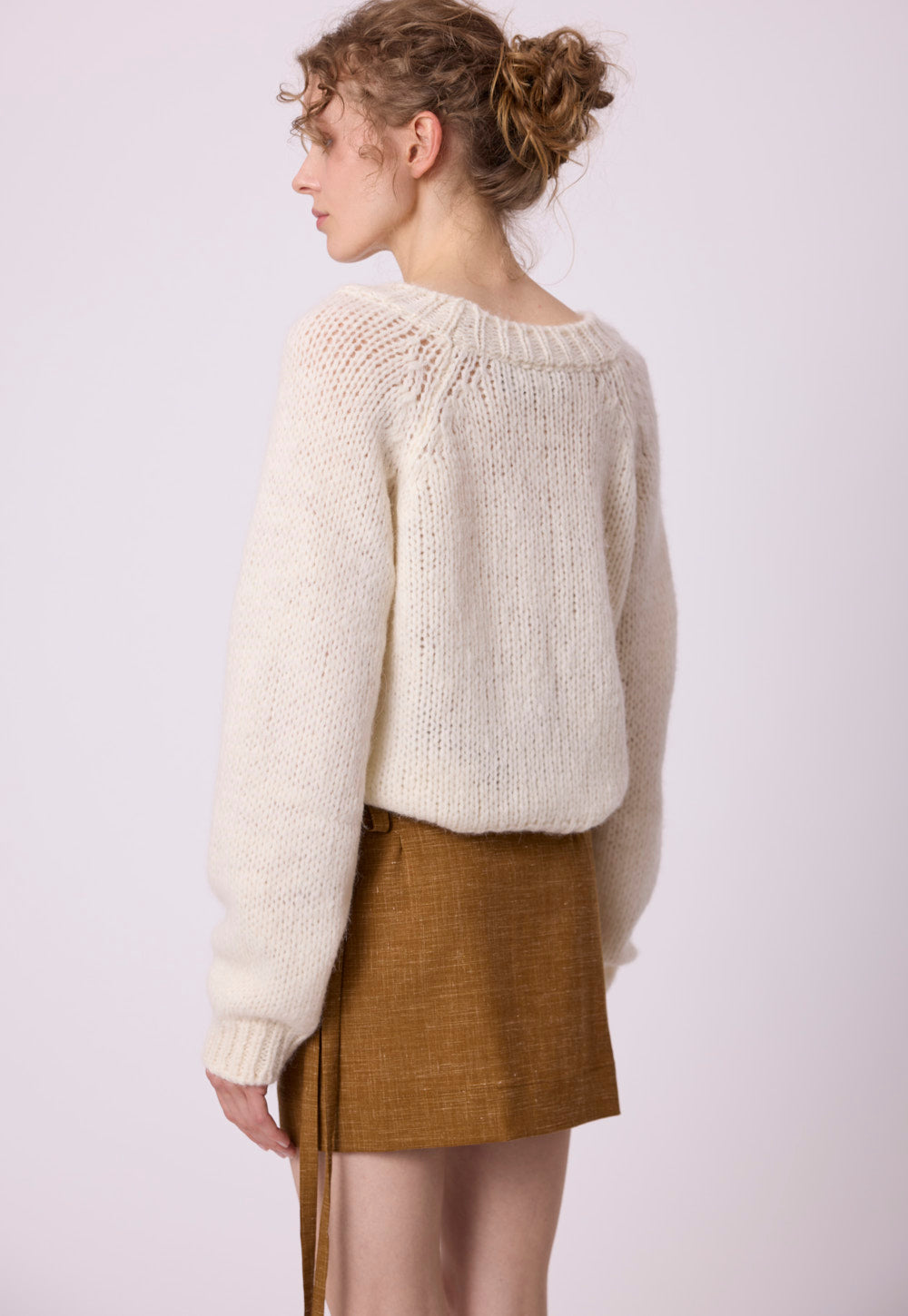 Close-up of Antonia Zander Ola Sweater in white, showing the soft, fluffy baby alpaca and silk blend knit texture.