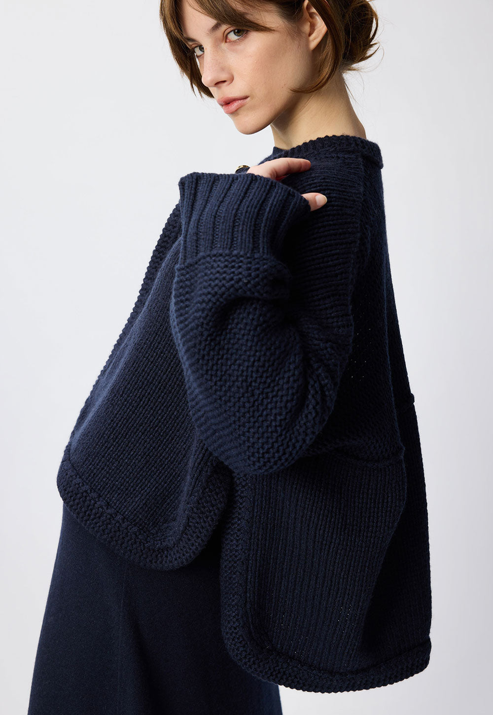 Antonia Zander Phania Cape in navy blue knit.