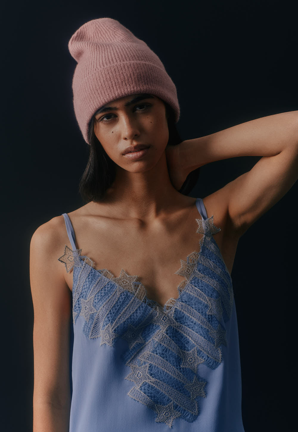 Model wearing the Antonia Zander Indra Top in Dusty Blue crafted from fluid acetate-silk satin with signature Celestial Lace.