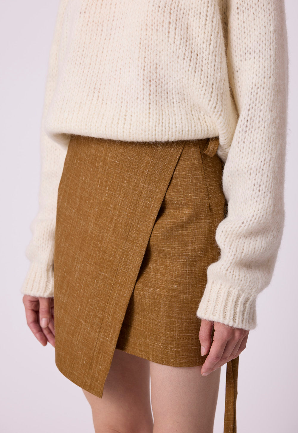 Detail view of the Antonia Zander Ola Sweater in white, highlighting the relaxed fit and lightweight knit.