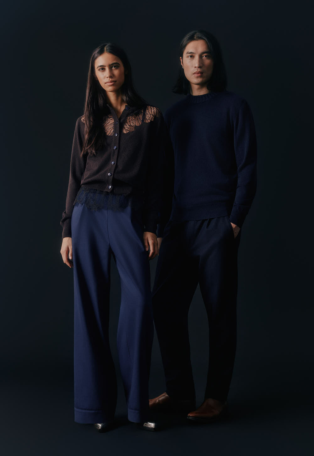 Model wearing the Antonia Zander Udra Top in Navy layered beneath the Peppa Cardigan, with the signature Celestial Lace subtly peeking out at the hem.