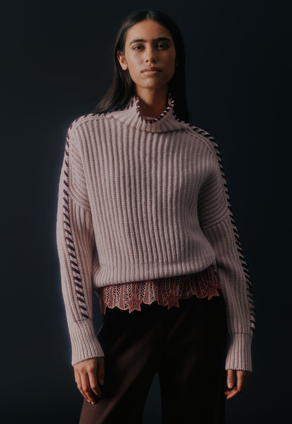 Cashmere sweater with contrast hand stitched details along sleeves and neckline