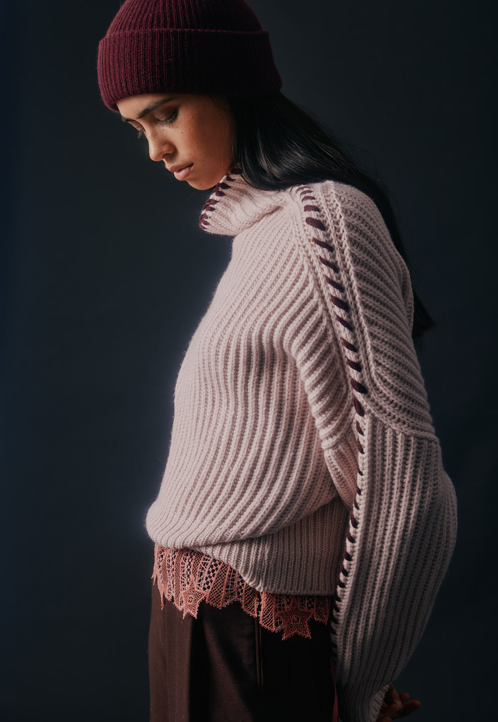 Cashmere sweater with contrast hand stitched details along sleeves and neckline