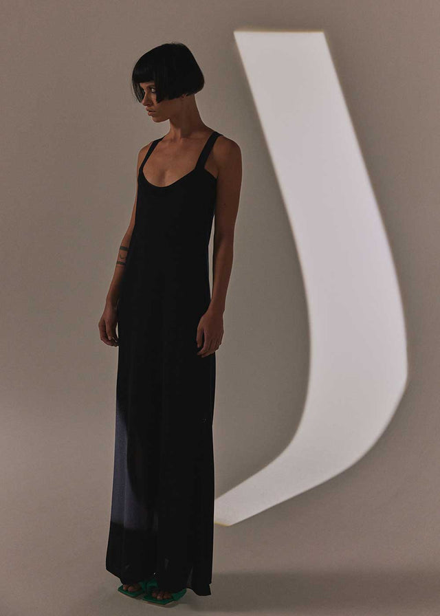 maxi knit dress with adjustable straps.flowing silhouette, pinholepattern detail